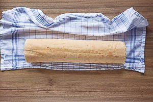 Zu einer Rolle aufrollen